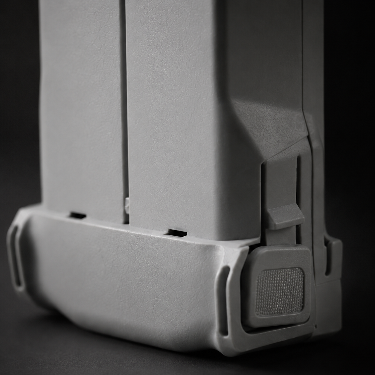 Latch and power button detail, Mini 3 family battery